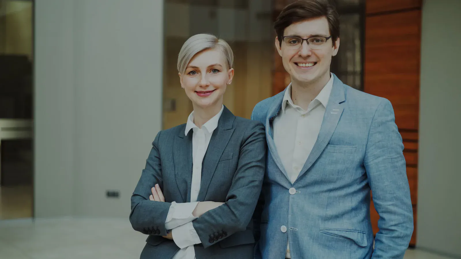 Two business colleagues standing together